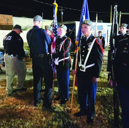 CHIEF CANDELARIA AND OFFICER BLACKBURN PRESENTING THE HONOR CORDS TO JROTC