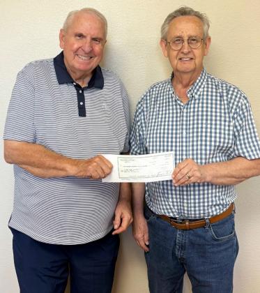 TO THE RESCUE Knox County Hospital CFO Dan Offut, left, received a $500,000 check from Knox County Judge Don Thompson for the purchase of a new ambulance. The funds were provided by HB 3000, passed in the most recent legislative session. | COURTESY PHOTO