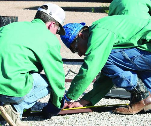 RPTS Last Strike Welding Contest KCHS team (l-r) Luke McGaughey Xavien Patterson and Ty Fridlle work on the construction and welding challenge of the contest. Sheri Baty/The Knox County News-Courier