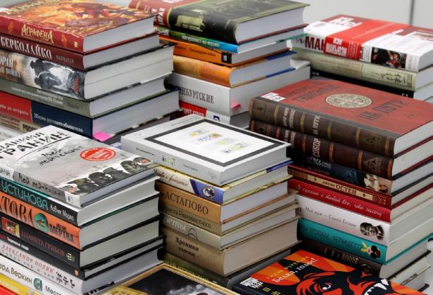 A giant stack of books. | UNSPLASH.COM