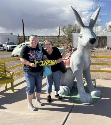 HEREWEARE Kay and Barbara with our own sign to remind us the distance from back home to the Jack Rabbit. | COURTESY PHOTO Farther along, we learn more about the cultural history of these emporia, which were far more than tourist traps. At the Navajo Trail Trading Post, a series