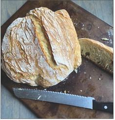 DUTCH OVEN BREAD This recipe is simple yet yields bakeryquality results with just flour, yeast, sugar, salt and water. Using a no-knead method and minimal rise time, the bread is ready in about three hours. The preheated Dutch oven creates a soft interior and crisp crust, making it a versatile and rewarding option for both beginners and experienced bakers. | ANGELINA LaRUE PHOTO