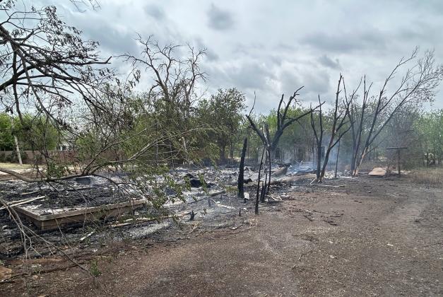 ASH AND CHARRED TREES Fire destroyed an abandoned house at the intersection of Munday Avenue and E Street early Friday morning. | TROY PARTON