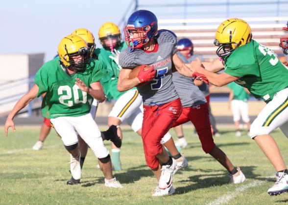 SCRIMMAGE Bently Stroud finds the hole and gains the yards.