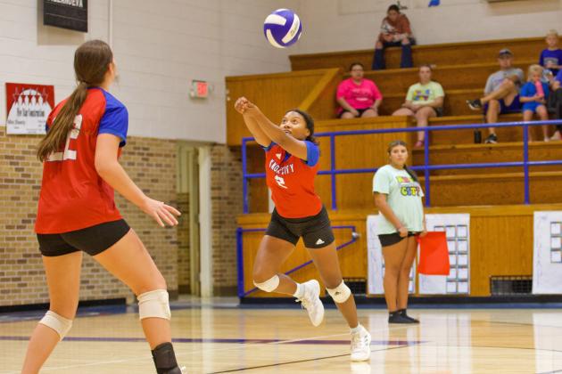 NAVEAH MARTINEZ digs deep in the back row. | SHERI BATY PHOTO