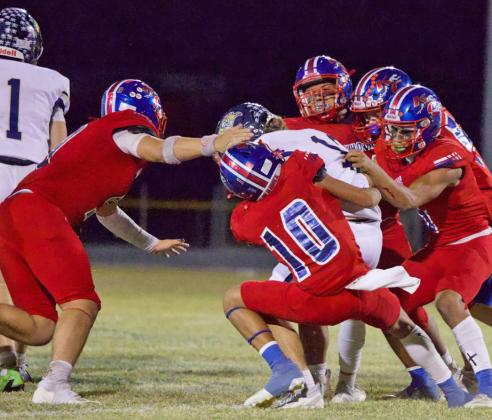 GODEFENSE The Greyhound defense makes the tackle in Friday’s win over Perrin-Whitt to finish off the season. | SHERI BATY PHOTO