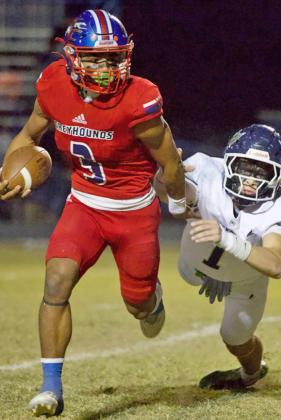 BROKEN TACKLE Zander Abila breaks the tackle and makes his way down the field toward Pirate territory at home on Knox City senior night. | SHERI BATY PHOTO