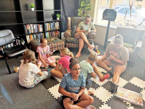 LIBRARY SUMMER READING Reading and board games for a fun Saturday for area youngsters at the Munday Library. So far participants have read 139 hours, and all readers have until Friday to finish up their reading. Join the library next Saturday for the prize giveaway. | COURTESY PHOTOS