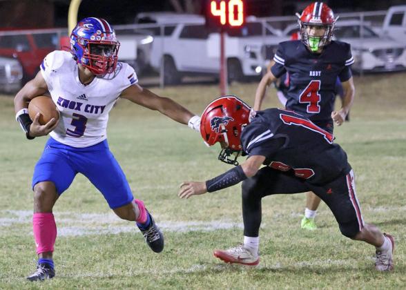 CAN’T TOUCH ME Zander Abila fends off a would be tackler, looking for a big gain. The Knox City Greyhounds won 86-80 in Roby Oct. 2. | SHERI BATY