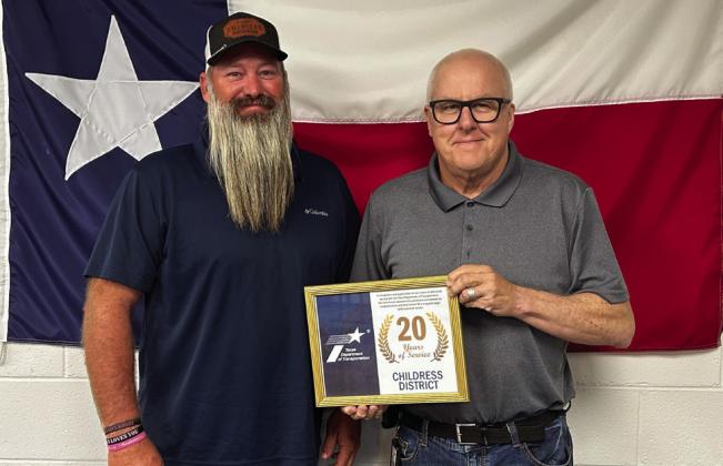 DWAYNE REDDER, Knox County maintenance, left, accepts his 20 years of service award from Childress District Engineer Darwin Lankford. Andrea Crownover, honored for 5 years of service, was not present for the awards ceremony. | TxDOT PHOTO