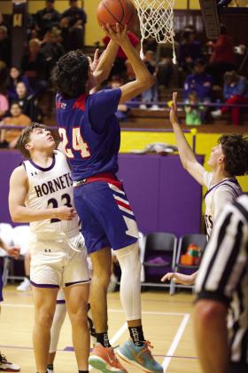 Blake Abila makes the two point jumper and hits the 1000 point career milestone. | SHERI BATY PHOTO