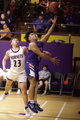 Cameron Hernandez reaches for the two point score. | SHERI BATY PHOTO