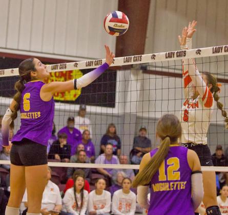 OVER THE NET Munday’s Brooke Urbanczyk puts the ball over the net in a hard fought game against Rotan Lady Hammers. | SHERI BATY PHOTO