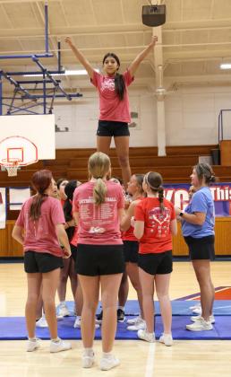 BASE TEAM Zynleigh Garcia works with her base team.