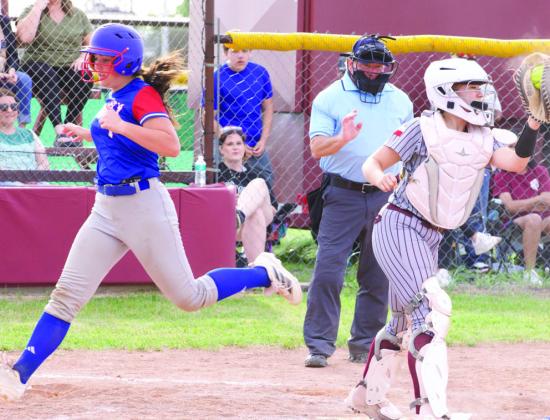 Savannah Friddle crosses the plate. | SHERI BATY PHOTOS