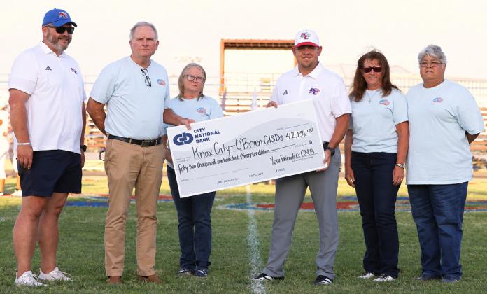 A MAJOR INVESTMENT City National Bank CEO presented Knox City coach Caleb Callaway with the check to purchase a new scoreboard and play clocks. On hand for the cerreomnywere,fromleft,Colin Howeth, Superintendent, Knox City O’Brien CISD; Wrey Montgomery, CEO, City National Bank; Caleb Callaway, Athletic Director/Head Football Coach, Knox City; Shyanne Scholl, COO, City National Bank, LaDonna Smith, Knox City Market President; and Faby Ledesma Vasquez, Knox City, City National Bank | COURTESY PHOTO