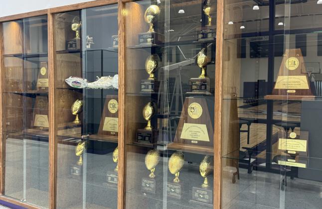 THE MANY FACETS OF COACH DON HASKINS In addition to trophies being displayed there are various items of memorabilia within a second case as visitors enter the gym. Known as The Bear, Haskins coached high school football, girls basketball and boys basketball. Outlined throughout the display is the coach’s amazing history and legacy.