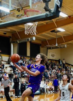 Ethan Flye attempts to steal the ball after a Mogul basket. | LACI BOWMAN PHOTO