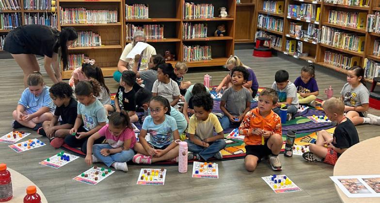 BINGO Students listen intently for the next letter – number combination to be called out seeking to win prizes.