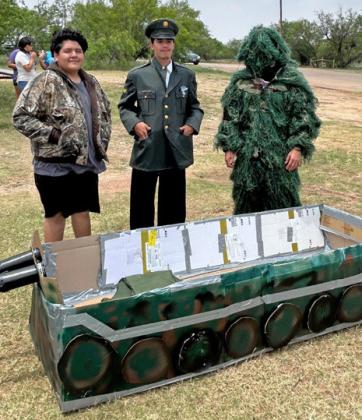ARMY BOAT? These would-be soldiers are ready to set sail, protecting our way of life—or at least seeking to get an A with their boat project.