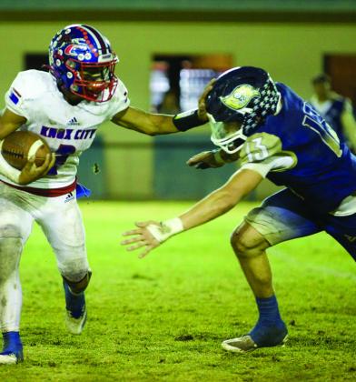 STIFFARMED Zander Abila pushes the Pirate back to gain some yards. | SHERI BATY PHOTO