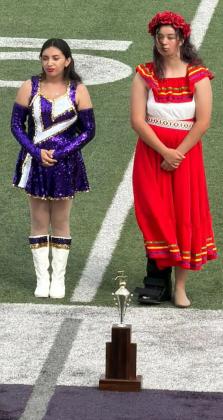 PROUD MOMENT Drum majors for the Munday Purple Cloud Band stand straight and proud with their 2nd place trophy Saturday, Oct. 3, at Abilene Wylie High School. | COURTESY PHOTO
