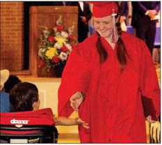 Arika Heilig gets a high five as she exits the commencement ceremony | SHERI BATY PHOTO