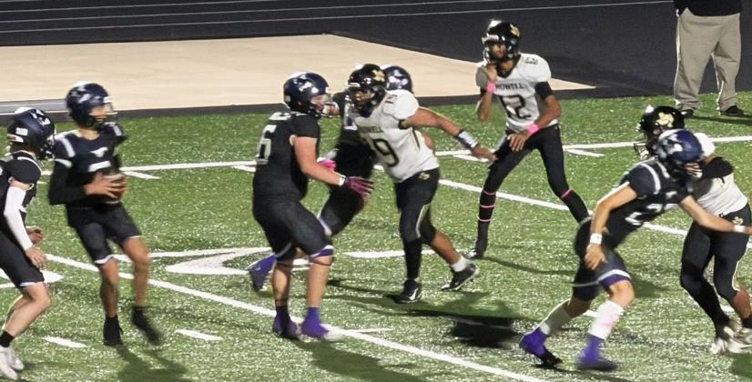 PROTECTING THE QUARTERBACK The Mustangs fight off the Wildcat defense in order to protect their quarterback. | COURTESY PHOTO