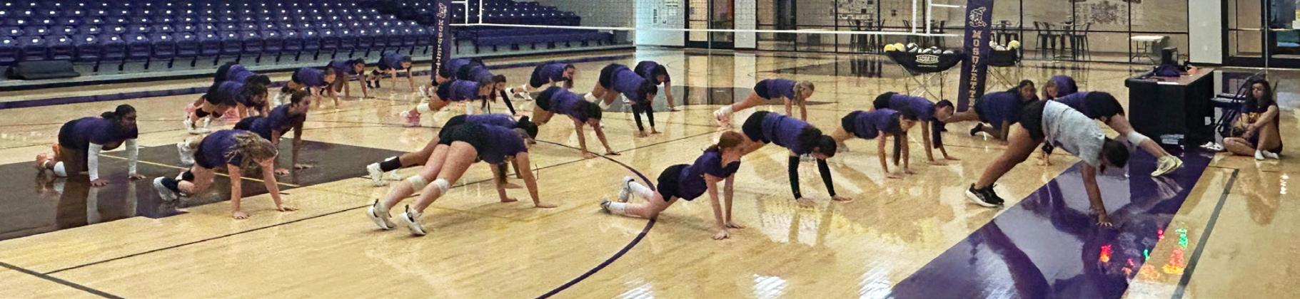 NEW COACH CASSIDY YOUNG led the Mogulettes in stretches before getting down to business. The Mogulettes will be competing in 2A District 7 this season, placing them in Region 1.