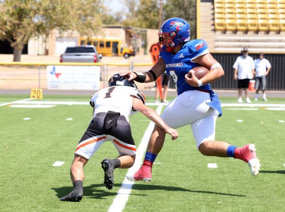 FIRST DOWN Chase Rowland tosses a pirate aside on way to a first down and a season opening win. | SHERI BATY