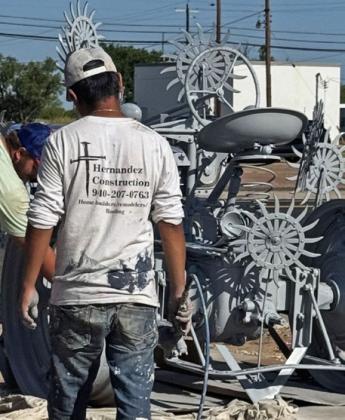 METAL MARVELS Knox City, Texas, has long enjoyed the benefits of delighting travelers and residents with its series of colorfully painted sculptures made from tractor and implement parts reimagined as insects, growing things, and more. They are installed throughout town, often in proximity to murals on weathered walls. | COURTESY PHOTOS