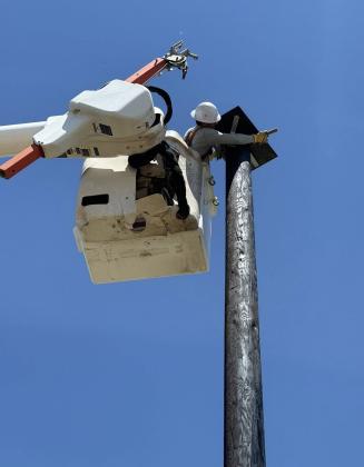 READY, DRILL, SET Workers from AEP prepared to set the new pole for installation of the warning system siren on South Aspen Street in Knox City. AEP provided the service for no cost as part of their community service program. | COURTESY PHOTOS