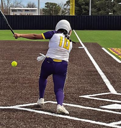 MOGULS OVER INDIANS Munday’s Serenity Sanchez connects for a single in Munday’s win over Quanah on March 13. | SUE JANE SULLIVAN