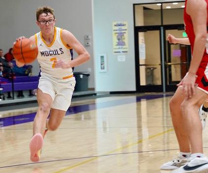 Connor Willison steals the ball and drives in for a layup. The game resulted in a loss by the Varsity MogulstoElectra58-43. | LACIBOWMANPHOTO