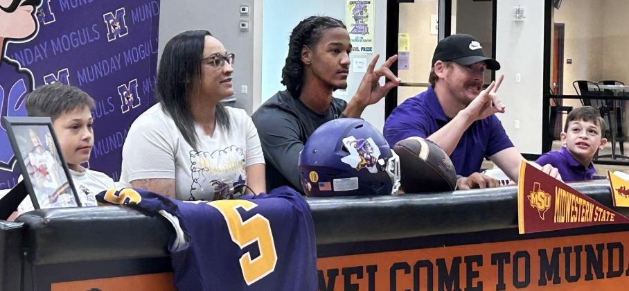 MOGULTO MUSTANG As he signed his letter of intent to play football for Midwestern State University, Ja’Riyis Williams (center) was surrounded by his mother, Shadee, stepfather, Ryan, and his two younger brothers. | COURTESY PHOTO