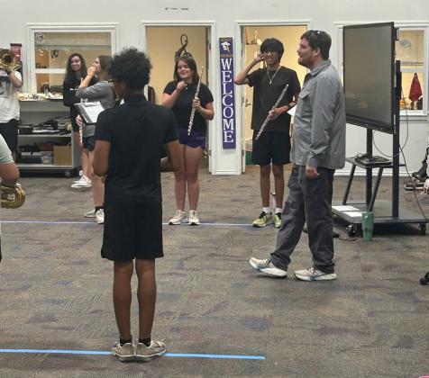 SMALL BUT MIGHTY Munday students working under new directors out of the heat for the first couple of practices refining the basics before hitting the field.