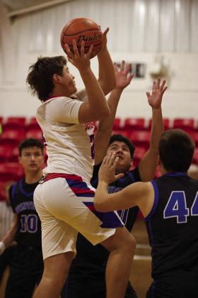 Chase Rowland looks for the net gain of two points | SHERI BATY PHOTO