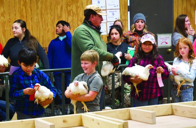 PRIZEWINNING CHICKENS ARE IN THE HOUSE These youngsters are having a fun time showing their chickens at the stock show. See Stock Show winners pages 8-10 | FREE SPIRIT PHOTOGRAPHY