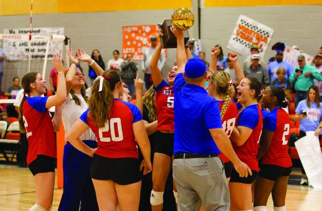 RAISING THE TROPHY The Houndettes celebrate the Bi-District win over Trent | SHERI BATY PHOTO