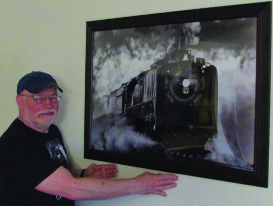 Bill Kessler with photo of engine Union Pacific #844. Don Thompson/The Knox County News-Courier