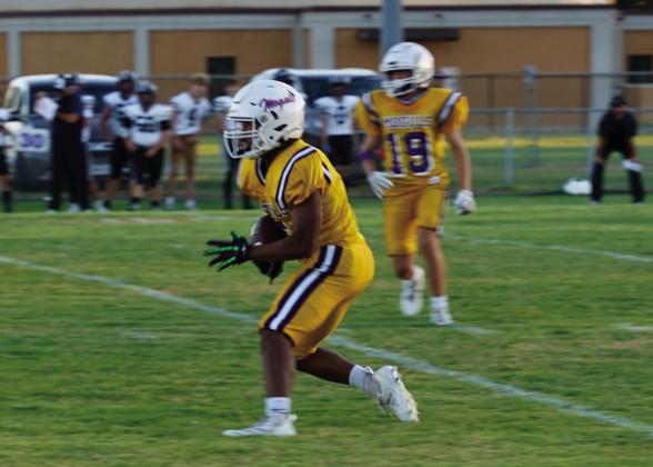 NOWHERE TO GO Senior Ethan Flye receives the kickoff and looks for some running room. | LACI BOWMAN