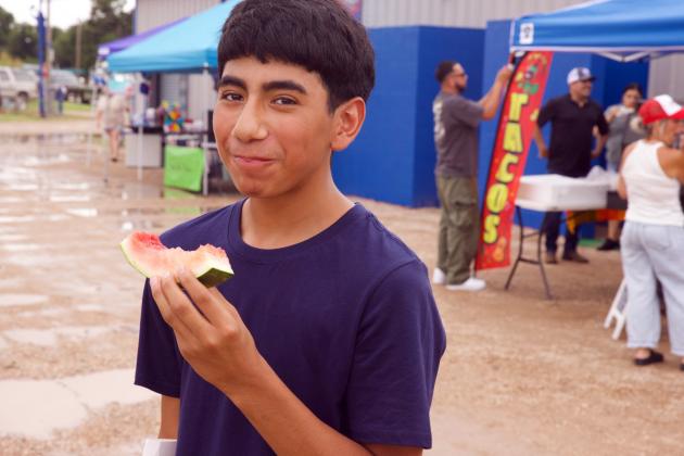 Brayan Samano enjoys his slice of watermelon