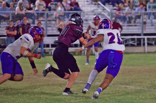 TAKING DOWN THE INDIAN Greyhound Defenders Chase Rowland and Ricardo Alvarez go for the Indian in an effort to take down the Northside offense. The game ended in a loss on the road for Knox City with Northside outscoring them 68-58. | SHERI BATY PHOTO