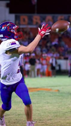 OPEN FIELD CATCH Bently Stroud with the catch and an open field. | SHERI BATY PHOTO