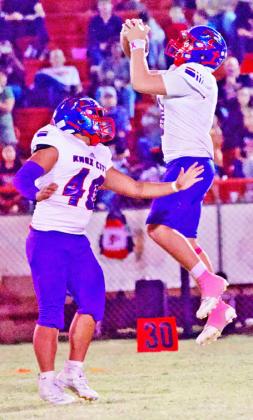 GAINING YARDS Chase Rowland goes vertical for the yards against the Dragons but the Greyhouns fell short in a loss of 72-36. | SHERI BATY PHOTO