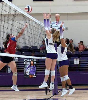 Net action was intense in the October 10 matchup between Knox City and Benjamin. Houndette Savannah Friddle works around the blocking efforts of Benjamin’s Addie Meinzer and Abbey Abilia.