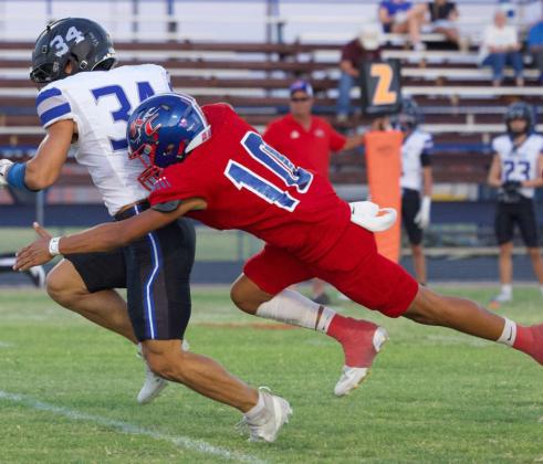 PANTHER DOWN Hunter Lerma takes down the Abilene Christian High School Panther Friday night during Knox City’s Homecoming. | SHERI BATY PHOTO