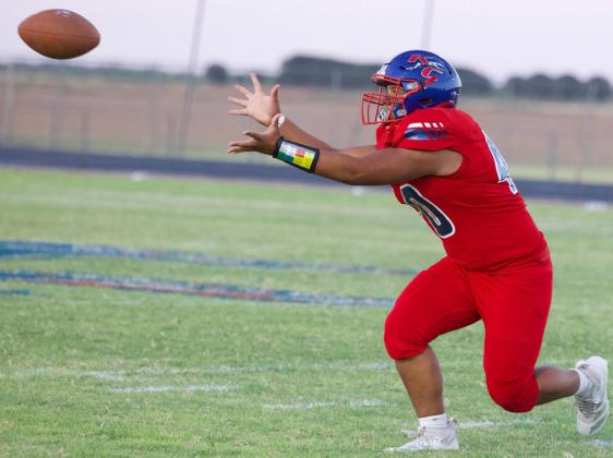 YARDAGE GAINED Joel Contreras makes the reception and gains some yardage for the Greyhounds, although hard fought they would eventually take the loss to the Panthers 90-40. | SHERI BATY PHOTO