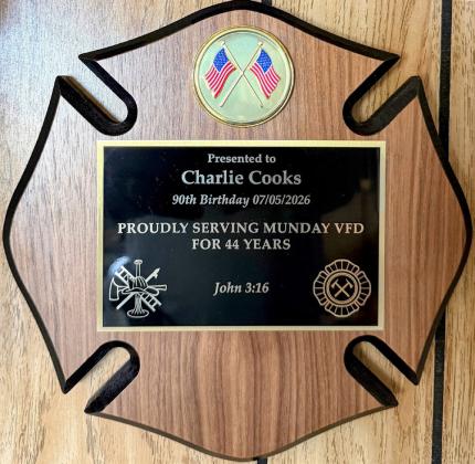 HARDWARE MOUNTED Cooks had this plaque up as soon as he got it home, informing those gathered for his birthday celebration that “his wall might fall down” from everything he has hanging on it. | COURTESY PHOTO