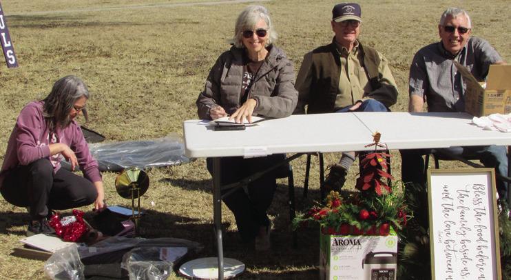FUNDRAISER Manning the tables outside at the Methodist garage sale, from left – Leann Harlan, Debbie Welborn, Jim Cowsert, Jamie Welborn | DON THOMPSON PHOTOS
